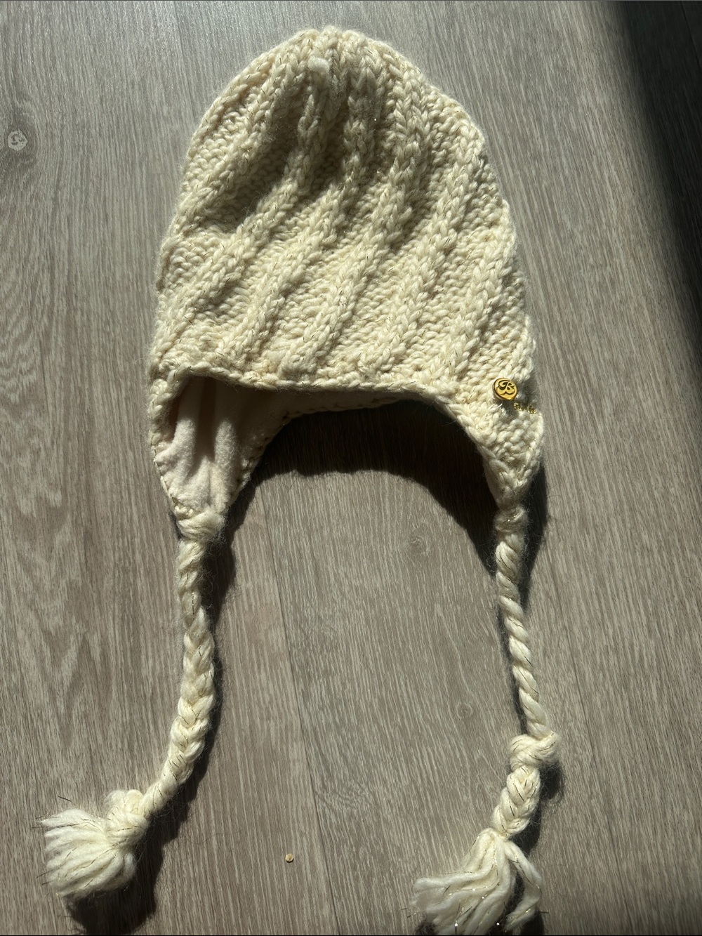 Cream Knit Earflap Hat with Braided Tassels. Preowned